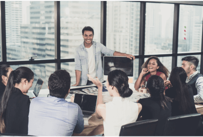 Business team collaborating in a meeting room with laptops