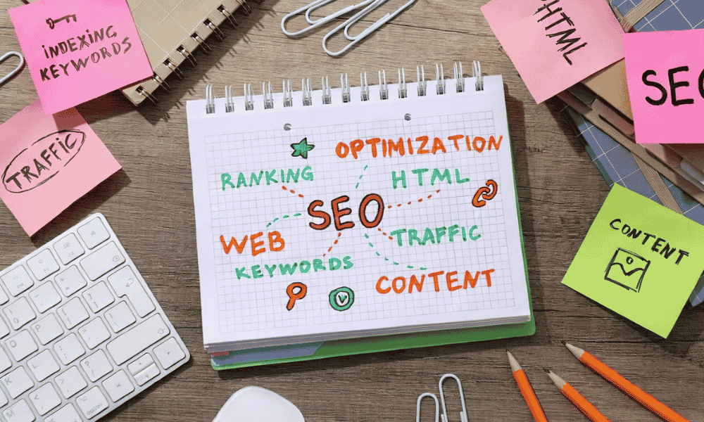 SEO and other relevent keywords written on a notebook lying around the other stationary items representing search engine optimization Utah
